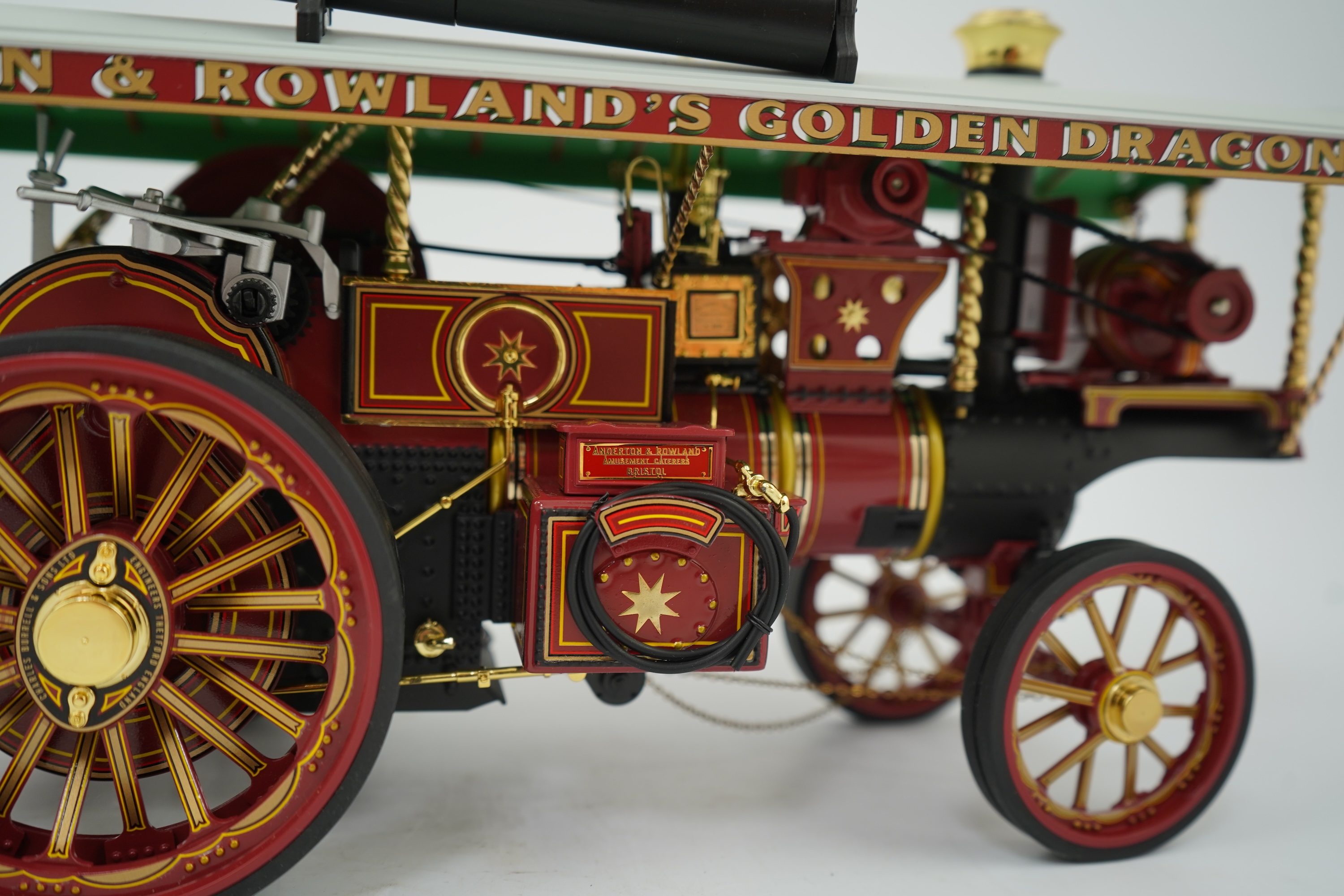 A Midsummer Models Ltd. 1:24 scale model of a Burrell Showman’s Engine, Earl Beatty, in ‘Anderson & Rowland’s Jungle Speedway’ livery, missing the original card box, but with an oak and Perspex display case